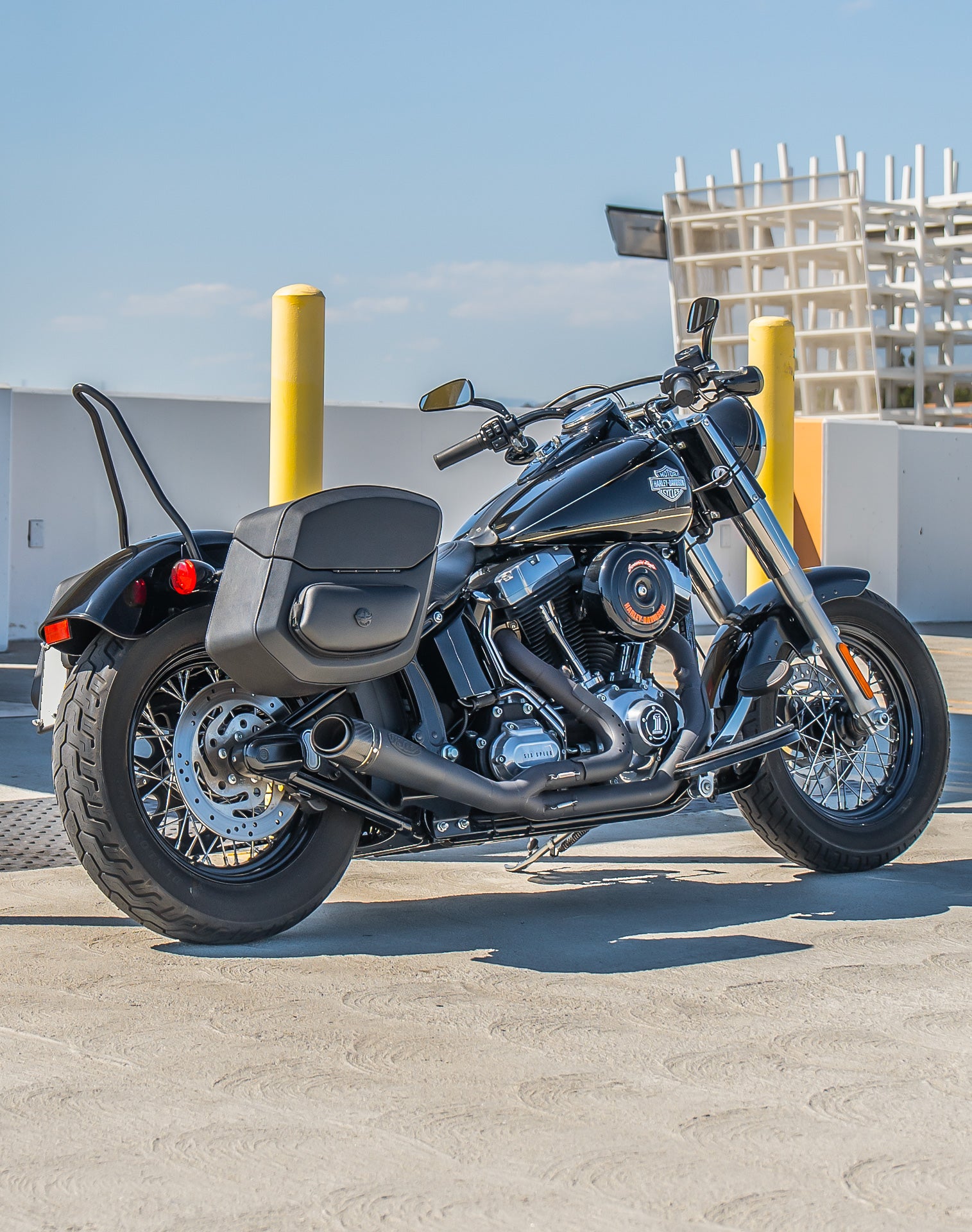 24L - Ironclad Quick-Mount Medium Harley Softail Slim FLS Leather Wrapped Hard Saddlebags Life Style 1