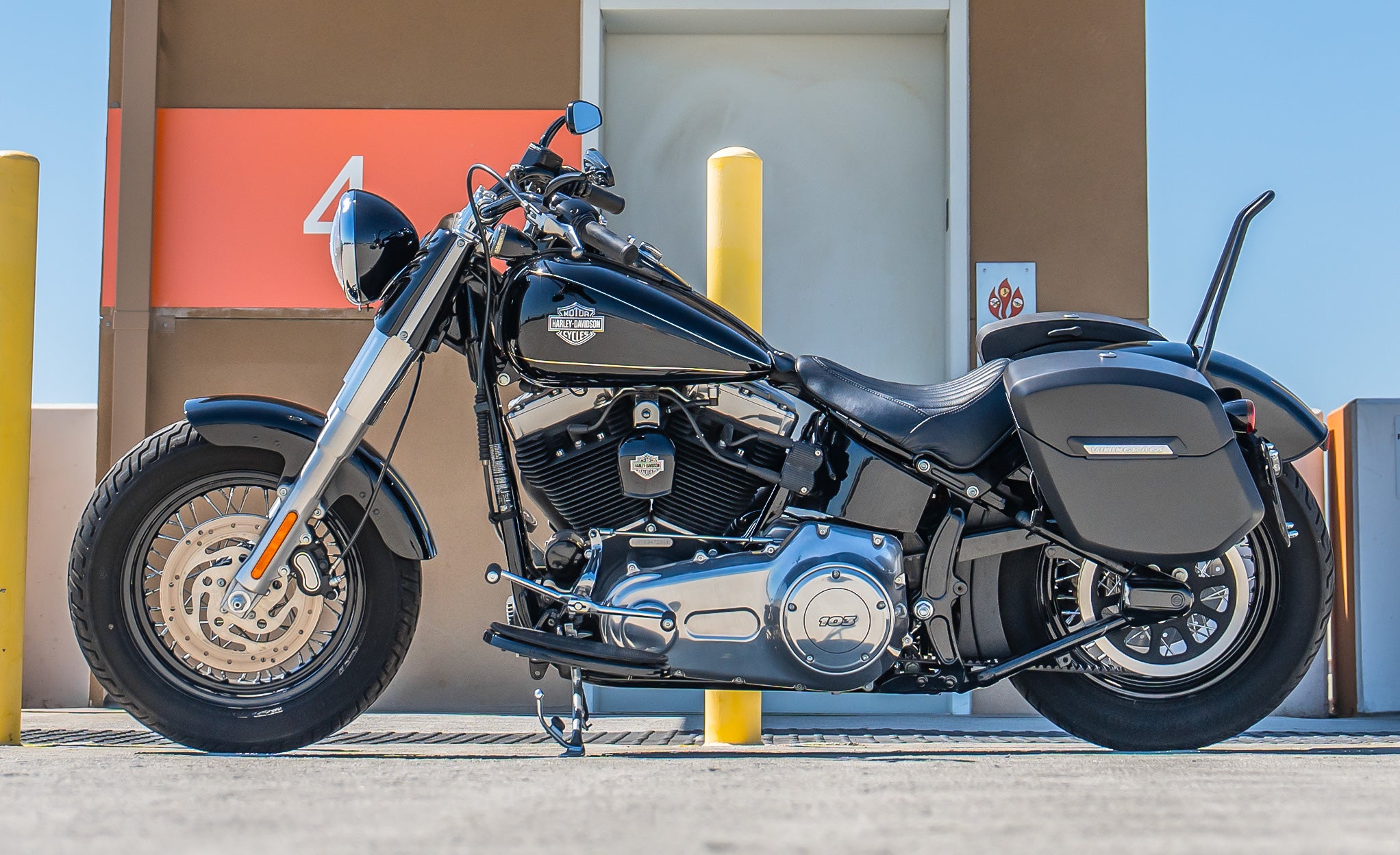 24L - Ironclad Quick-Mount Medium Harley Softail Slim FLS Matte Hard Saddlebags Life Style Photo @expand