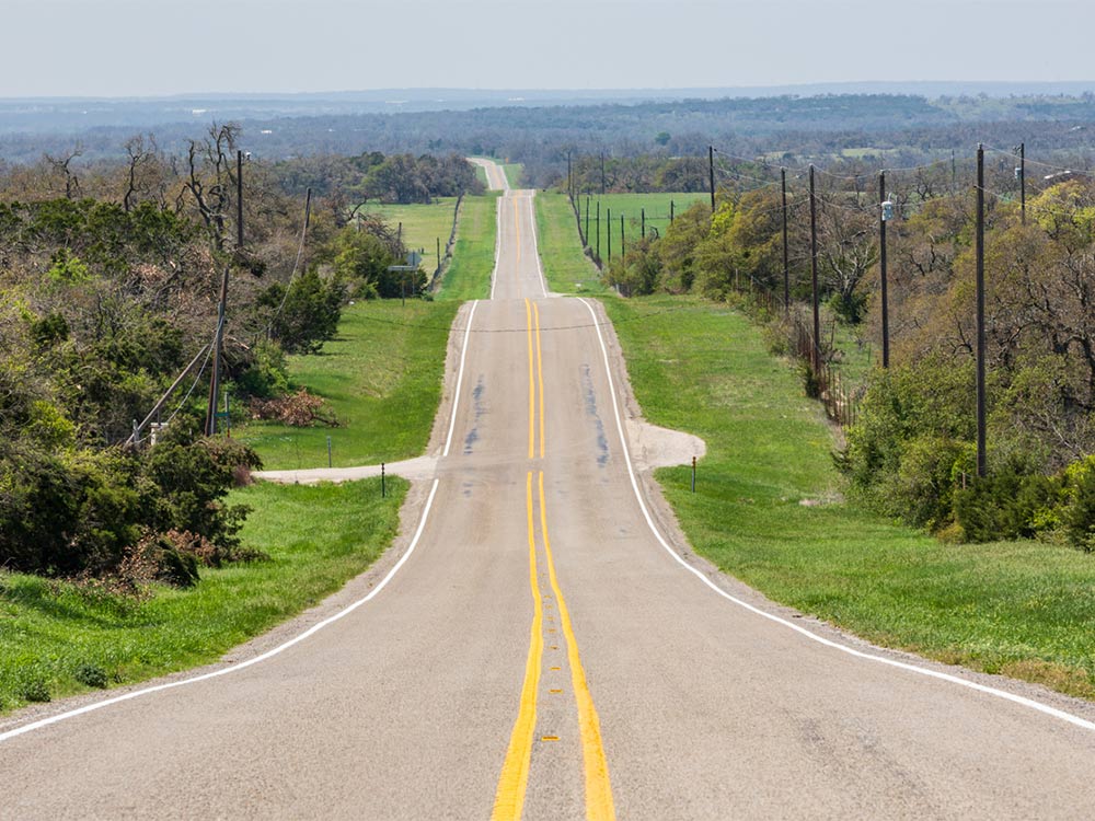 Johnson-City-Texas-USA-an-empty-country-road-in-the-Texas-hill-country