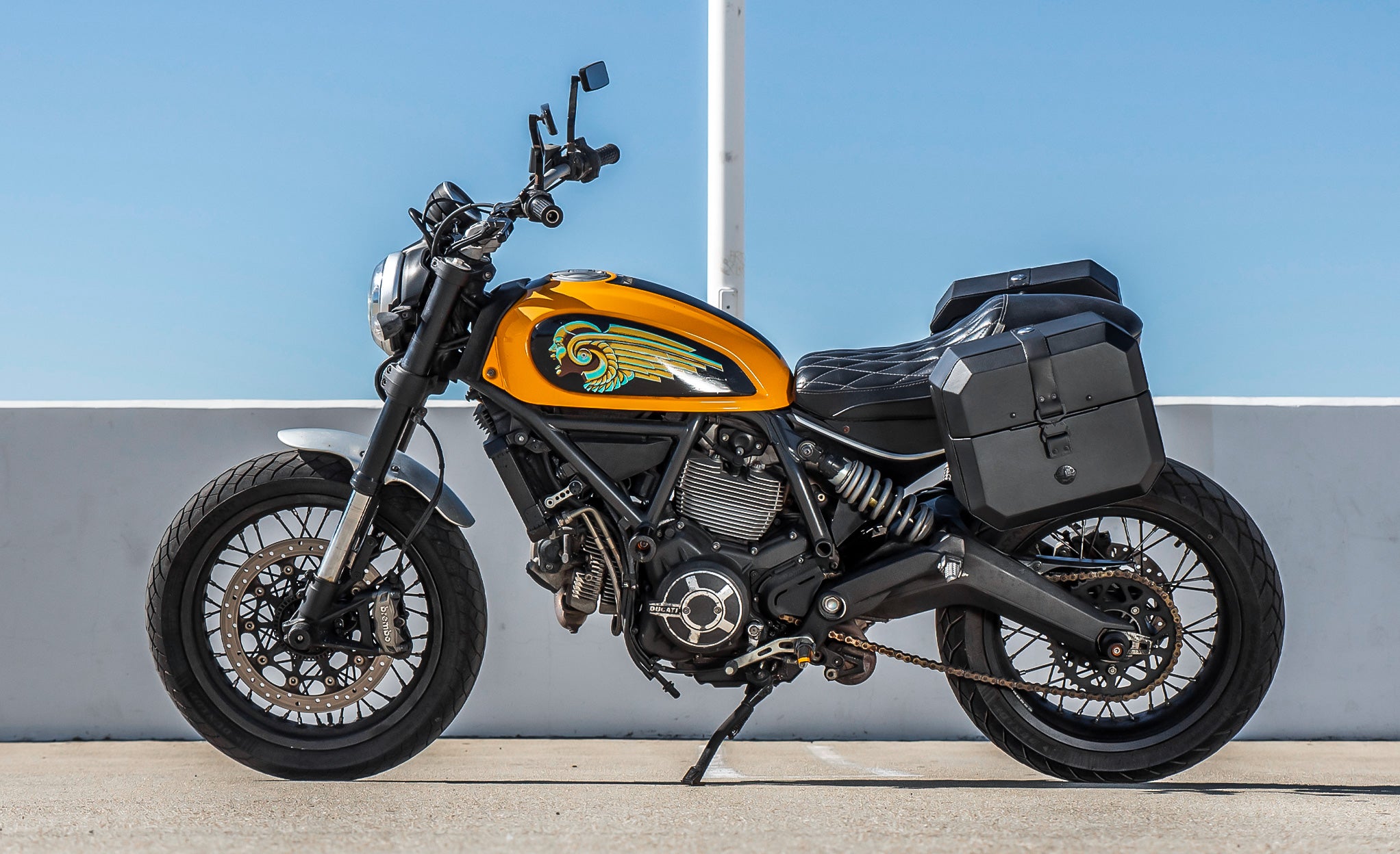 20L - Outlaw Quick-Mount Small Ducati Scrambler (2014-17) Leather Wrapped Hard Saddlebags Life Style Photo @expand